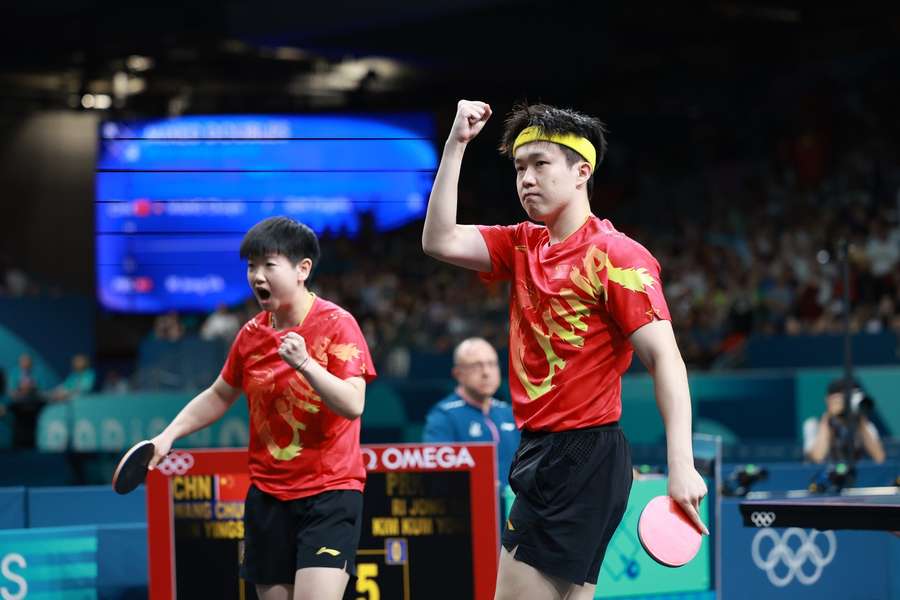 Wang Chuqin and Sun Yingsha of China react during the mixed doubles gold medal match