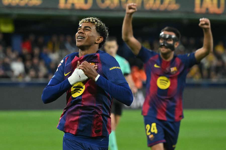 Lamine Yamal (left) celebrates scoring for Barcelona