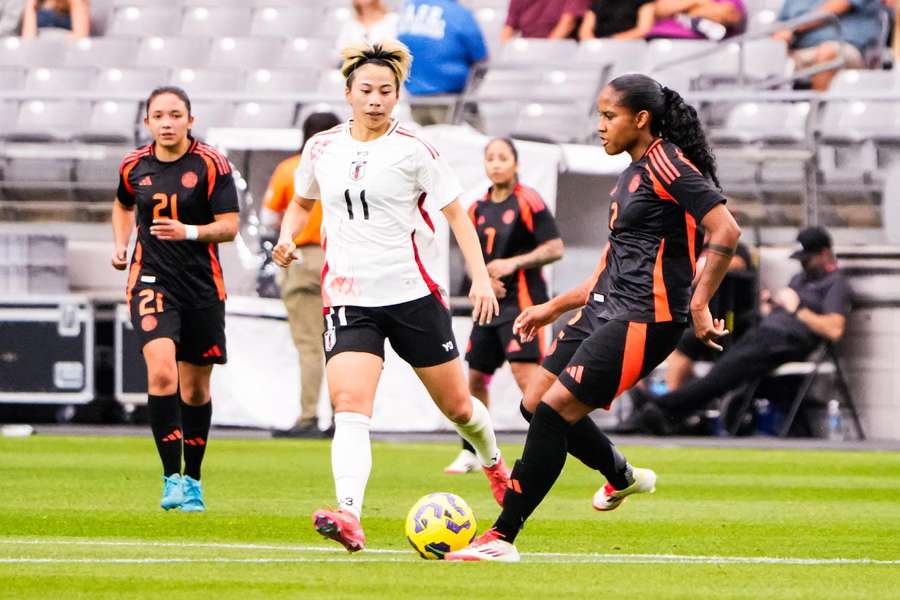 Mina Tanaka (#11 in white)