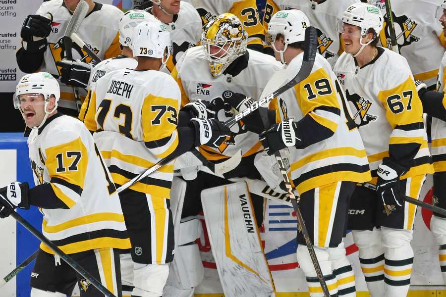 Nedeljkovic embraced by his excited teammates.