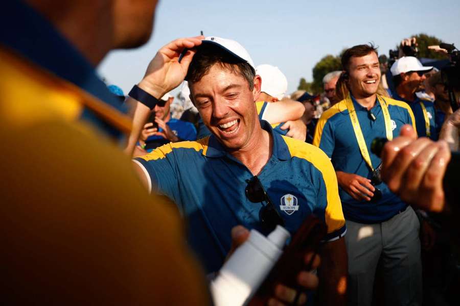 McIlroy celebrates on the 18th green after winning the Ryder Cup
