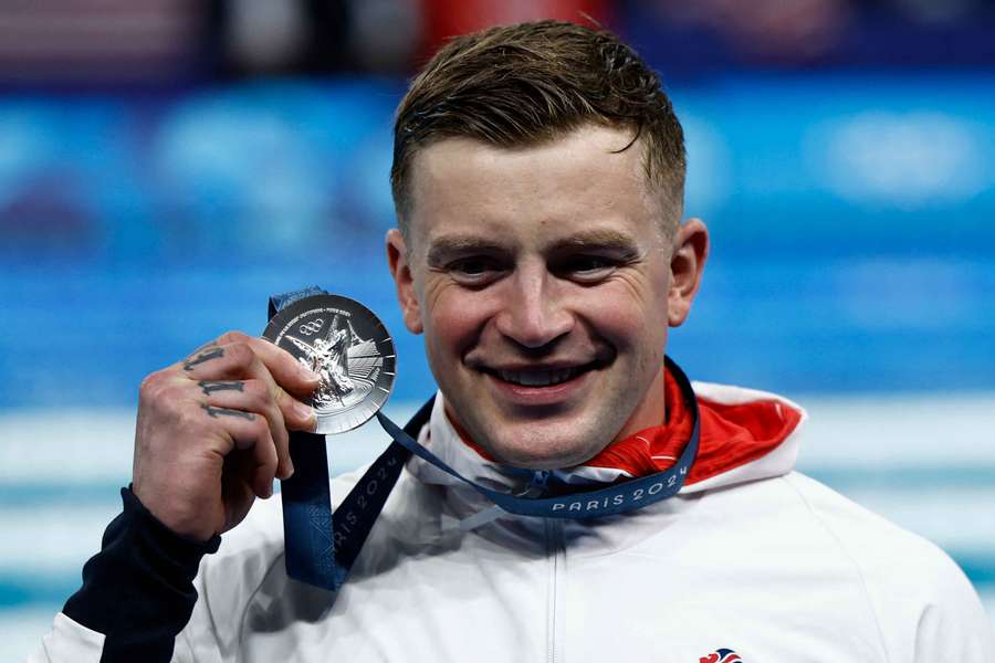 Britain's Adam Peaty with his silver medal on Monday