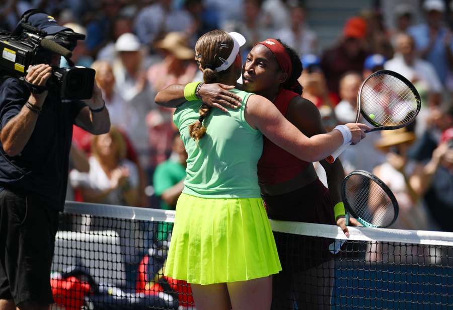 USA's Coco Gauff (R) greets Latvia's Jelena Ostapenko after winning their match during the US Open tennis tournament women's singles quarter-final