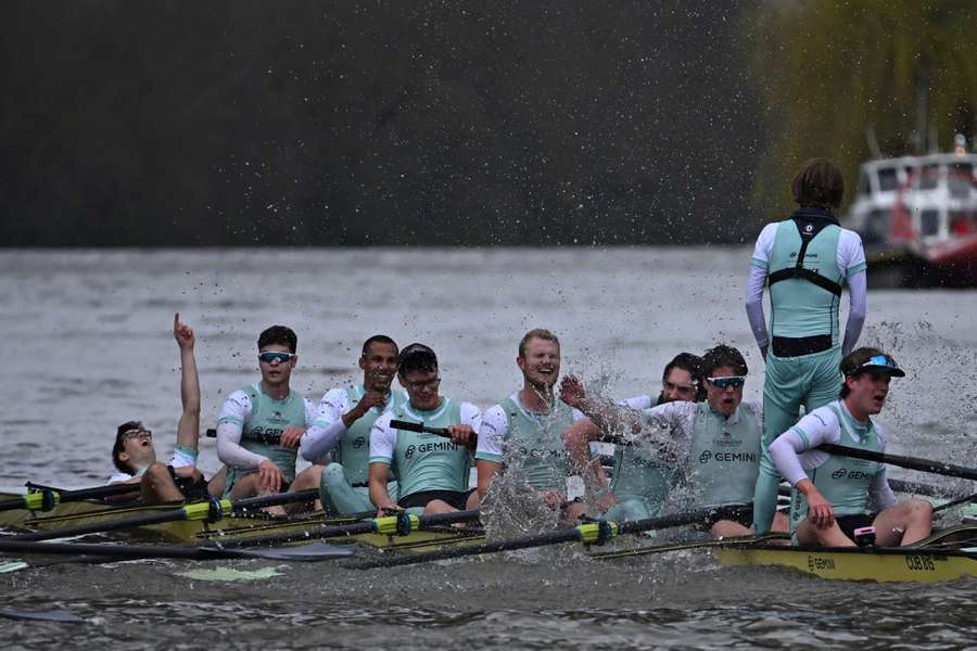 The Cambridge crew celebrate after their victory