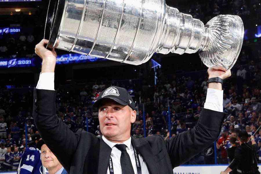 Mathieu Darche lifting the Stanley Cup in 2021 as a member of the Tampa Bay Lightning front office