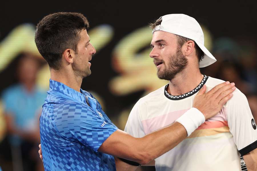 Serbia's Novak Djokovic greets Tommy Paul of the US after his victory during their men's singles semi-final match