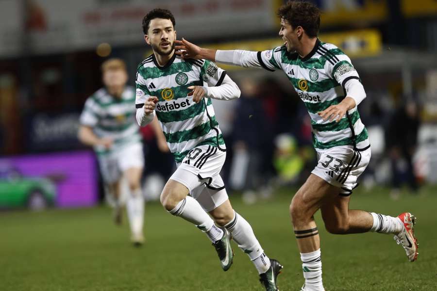 Mikey Johnston celebrates scoring Celtic's second goal against Dundee