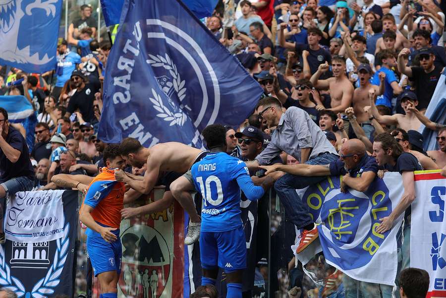 M'Baye Niang of Empoli FC celebrates with fans after scoring a goal