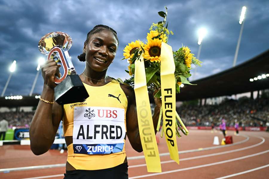 Saint Lucia's Julien Alfred celebrates winning the 100m final on Thursday Saint Lucia's Julien Alfred celebrates winning the 100m final on Thursday