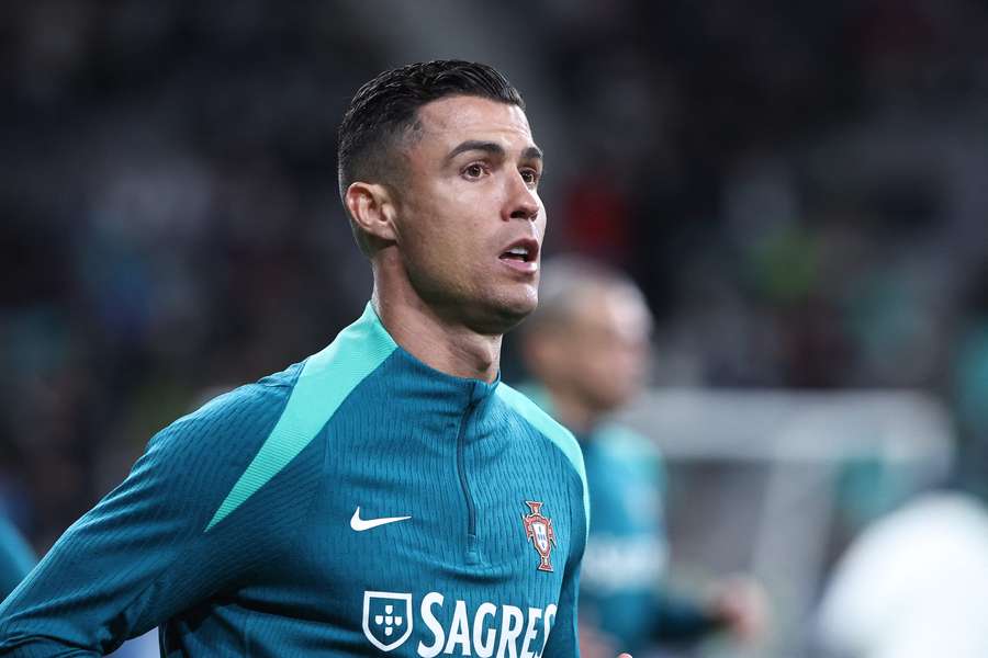 Cristiano Ronaldo of Portugal warms up ahead of the Euro 2024 qualifying playoff semi-final between Slovenia and Portugal