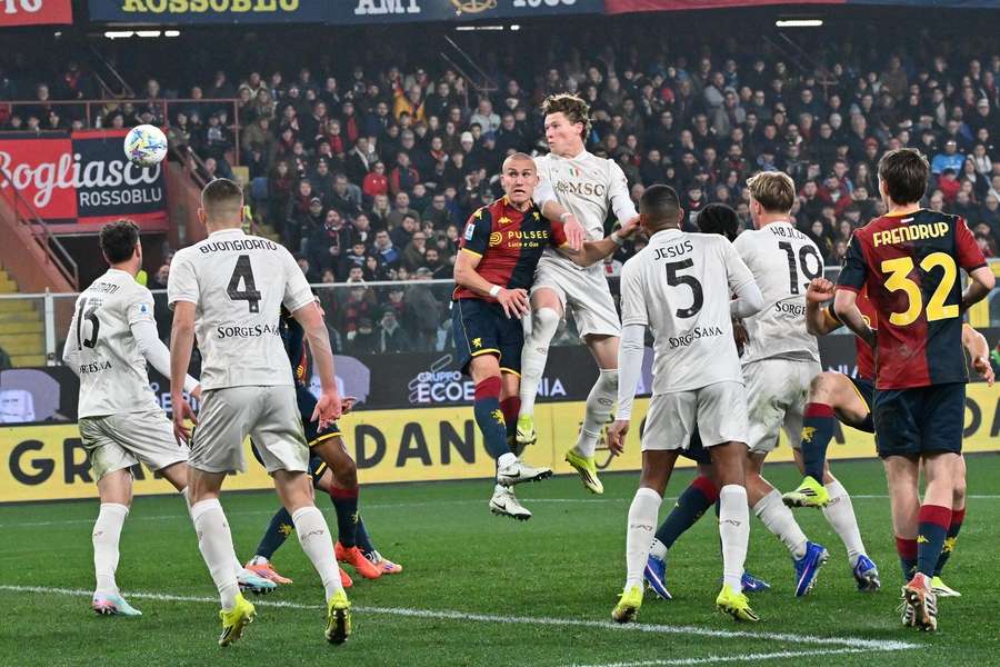 Napoli's Scott McTominay heads goalwards during the game against Genoa