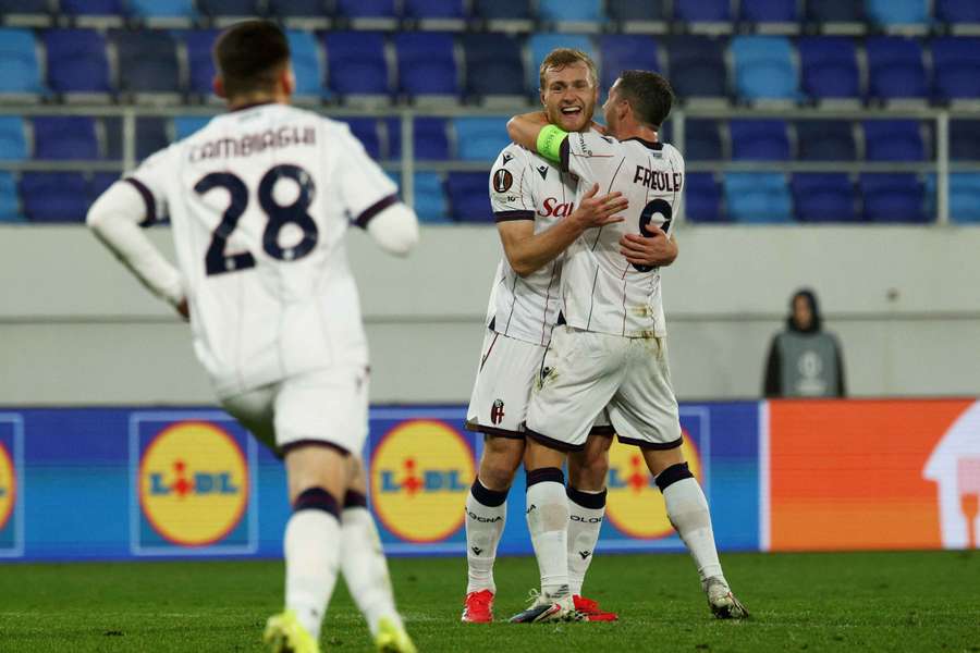 Bologna's players celebrate a goal