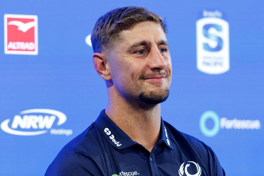 Zac Lomax speaks at a media event to acknowledge his move to the Force. 