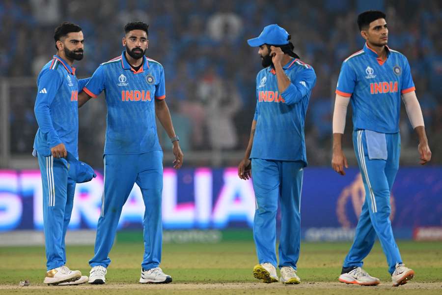 India walk back to the pavilion after suffering World Cup heartbreak on home soil