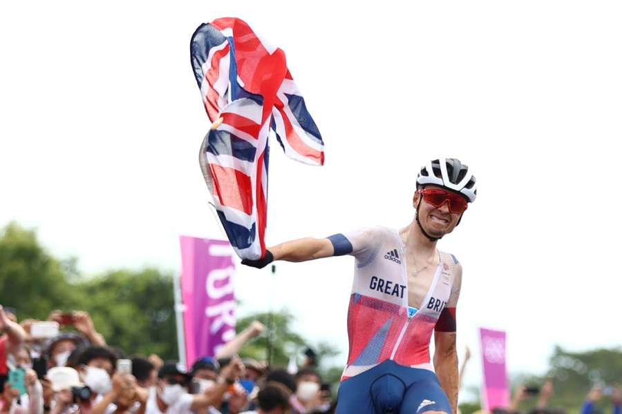 Tom Pidcock celebrates his triumph