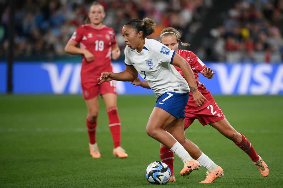 Lauren James runs past a Denmark defender