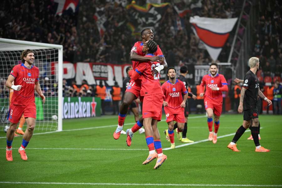 PSG celebrate one of their seven goals against Bayern Leverkusen