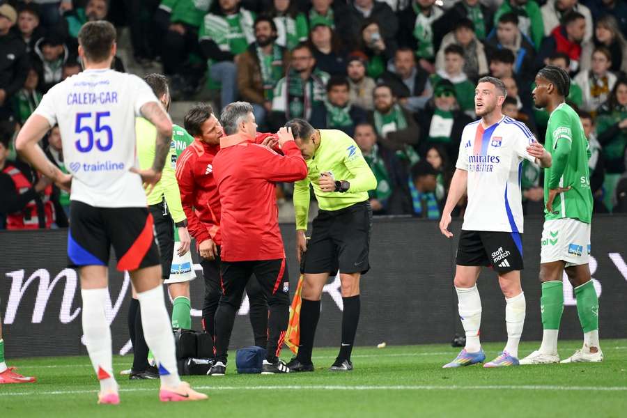 Assistant referee Mehdi Rahmouni after being hit by an object during the Ligue 1 match between St Etienne and Lyon 