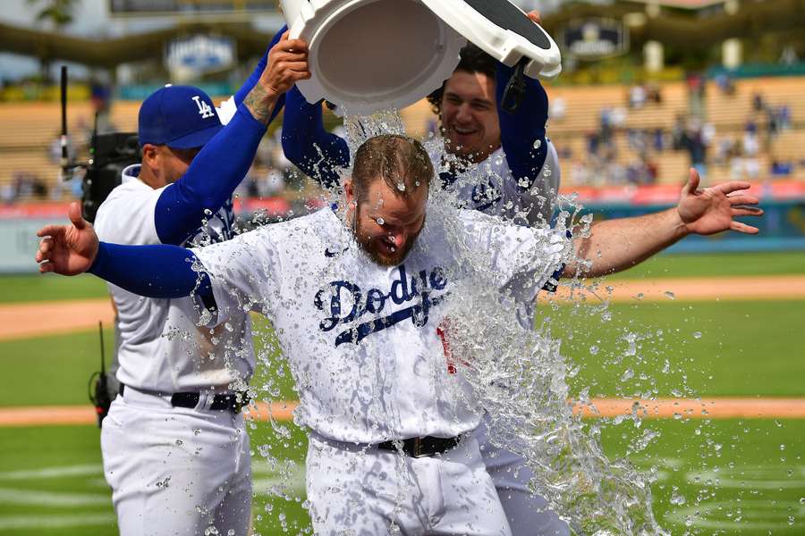 Dodgers' Peralta and Outman pour water on Muncy after he hit a walk off grand slam home run