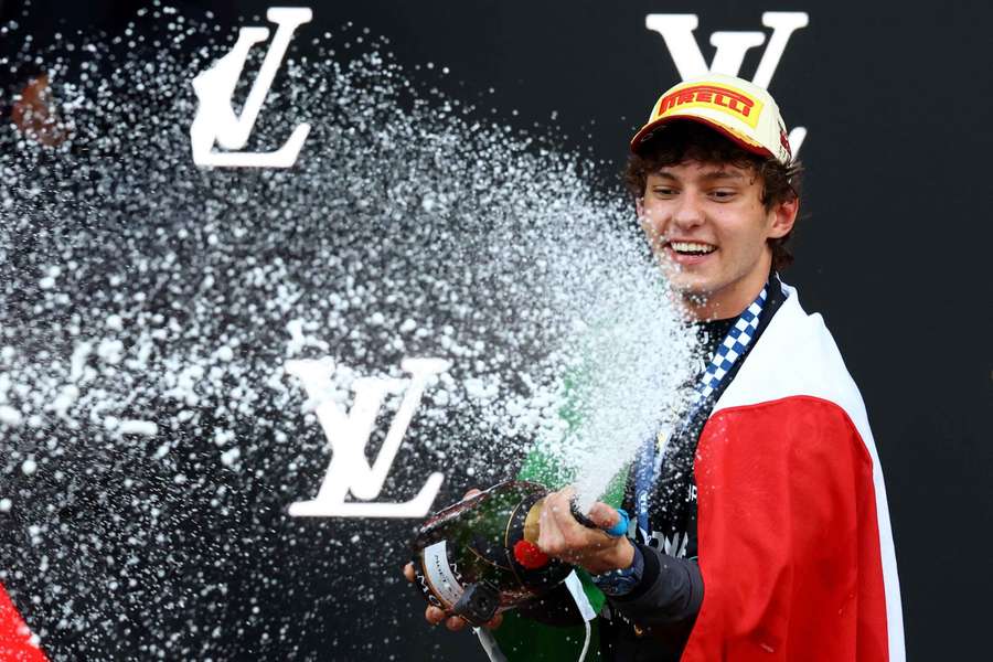 Kimi Antonelli sprays champagne after winning the Monaco Grand Prix