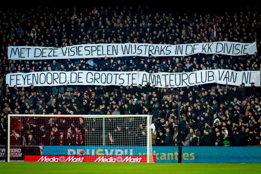 Feyenoord fans unveiling a banner aimed at the board and manager