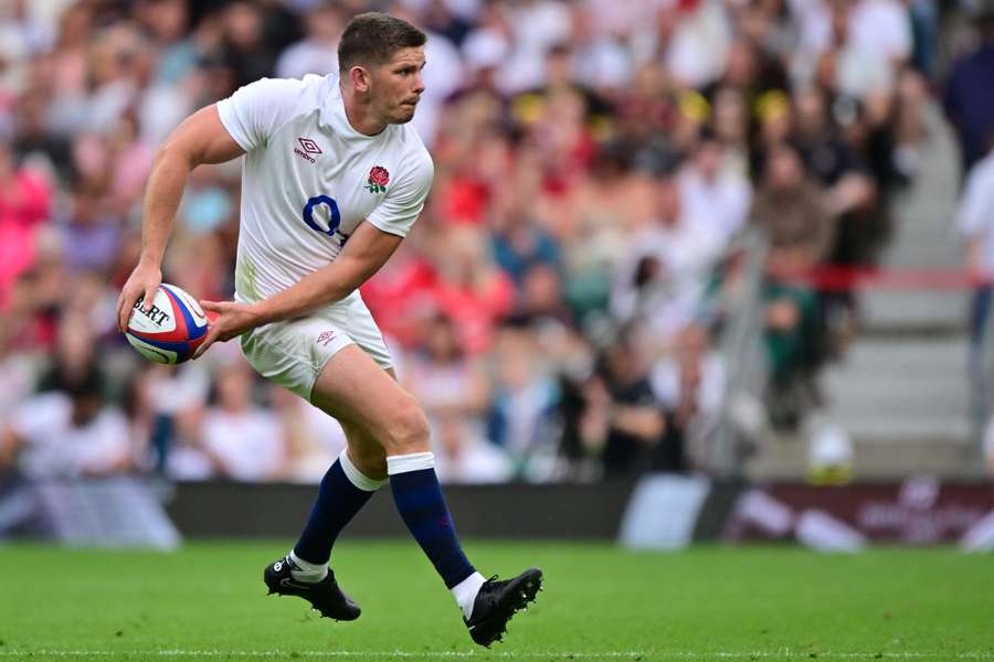 Owen Farrell passes the ball during England's international friendly against Wales