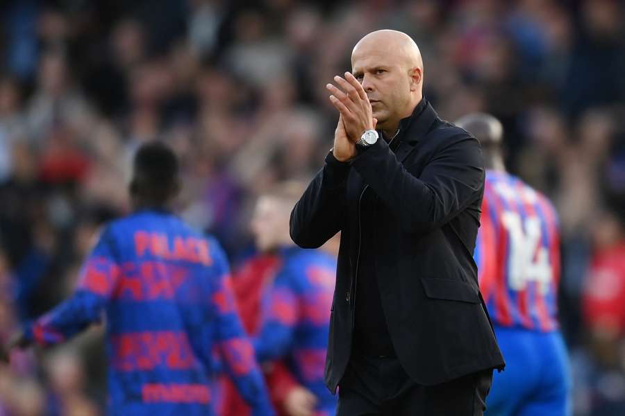 Arne Slot applauds supporters after Liverpool's defeat to Palace on Saturday