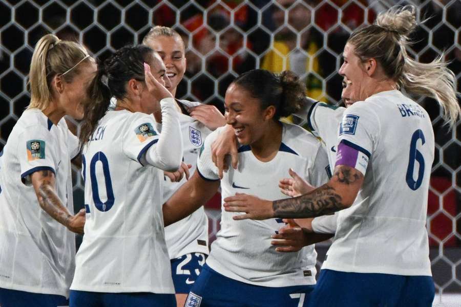 Lauren James celebrates with teammates after scoring her first goal, and England's third, against China