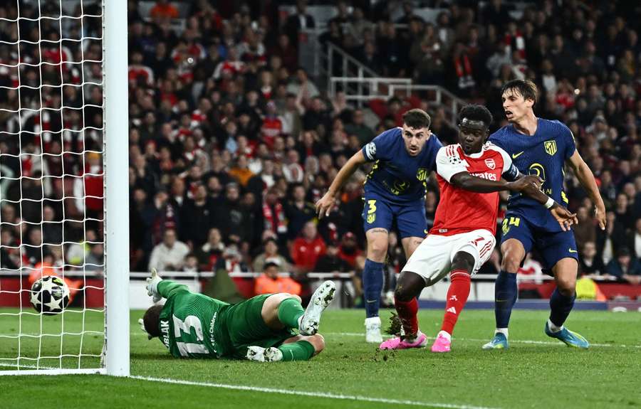 Arsenal's Bukayo Saka scores past Atletico Madrid's Jan Oblak