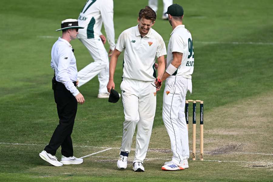 Tasmania's Lawrence Neil-Smith leaves the field injured during a Sheffield Shield game against Victoria last season. 