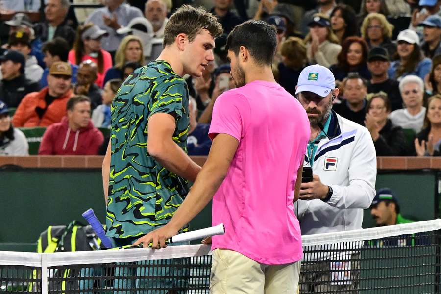 Spain's Carlos Alcaraz (R) greets Britain's Jack Draper (L) at the net