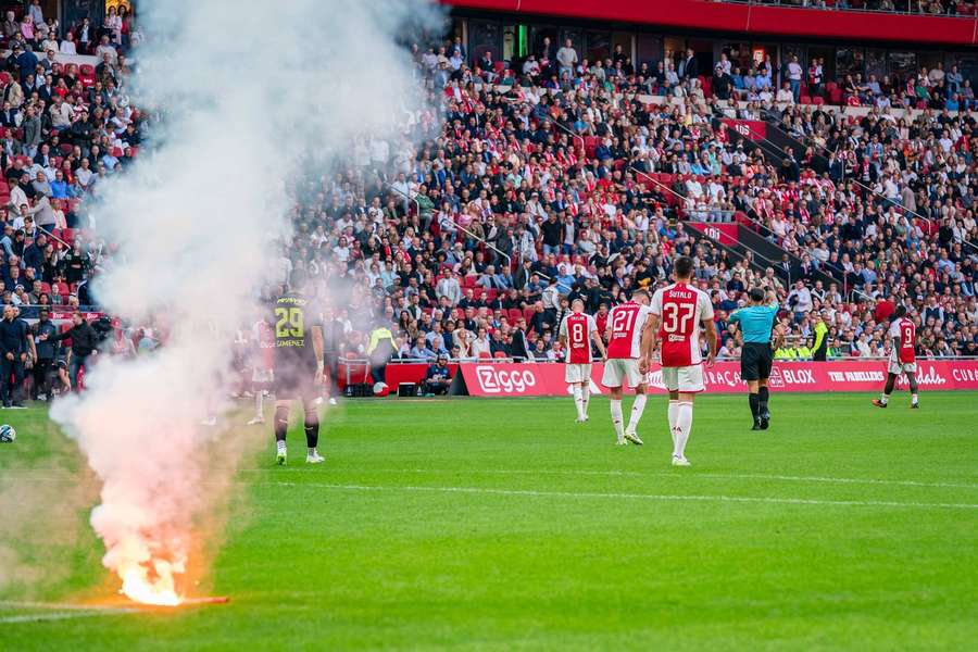 Ajax's game against Feyenoord was suspended after home fans threw fireworks onto the pitch