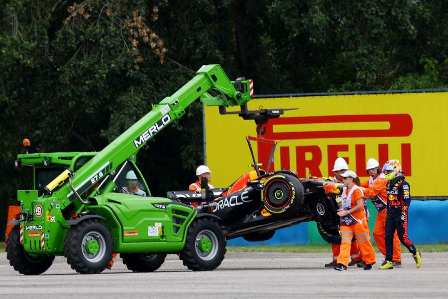 Marshals remove Red Bull's Sergio Perez car from the track during practice in Hungary