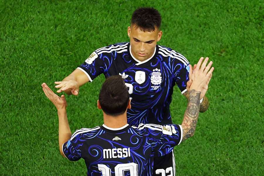 Lautaro Martinez celebrates alongside Lionel Messi