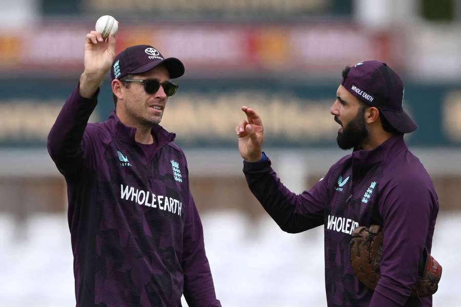 New Zealand legend Tim Southee offers advice to England's Saqib Mahmood.