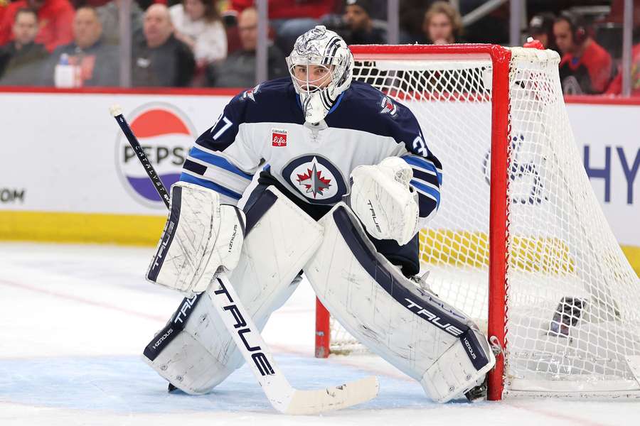 Winnipeg Jets goalie Connor Hellebuyck in net against the Chicago Blackhawks (December 2004)