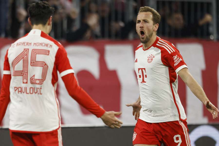 Harry Kane celebrates scoring Bayern's second goal against Stuttgart