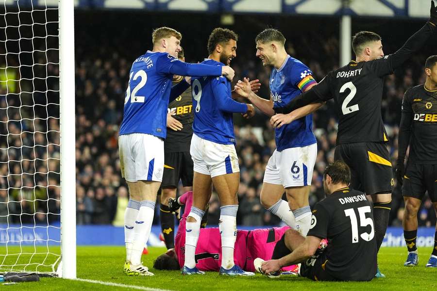 Everton players celebrate their side's third goal of the game, scored by Wolverhampton Wanderers' Craig Dawson