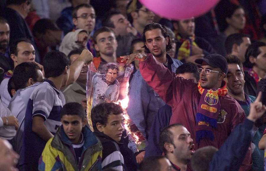 Barcelona supporters burn a portrait of Portugese player Luis Figo Barcelona supporters burn a portrait of Portugese player Luis Figo