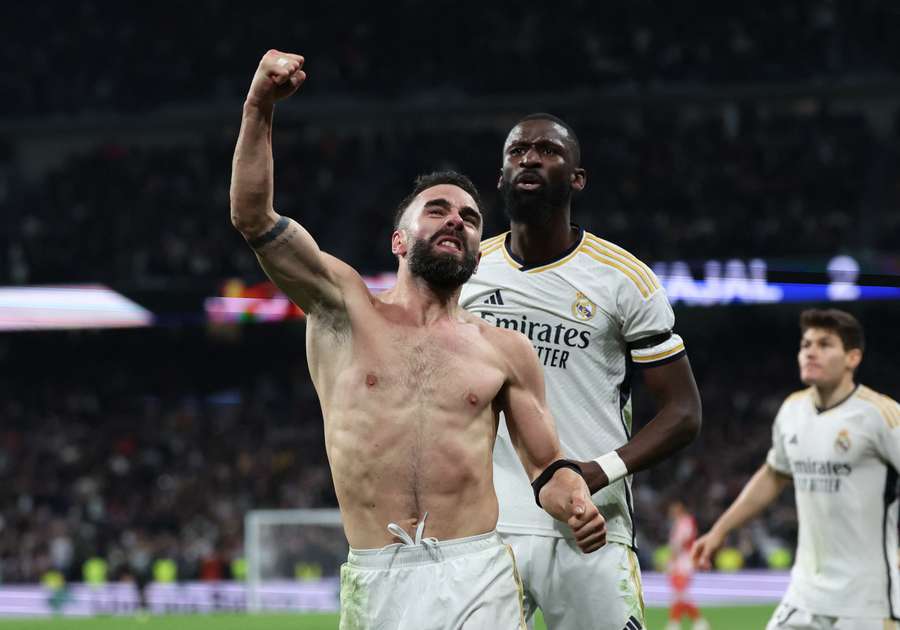 Real Madrid's Spanish defender #02 Dani Carvajal (L) celebrates scoring his team's third goal