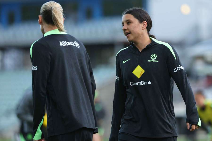 Sam Kerr speaks with Emily van Egmond (left) at a Matildas training session.  Sam Kerr speaks with Emily van Egmond (left) at a Matildas training session.
