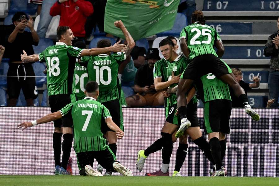 Sassuolo players celebrate their winning goal