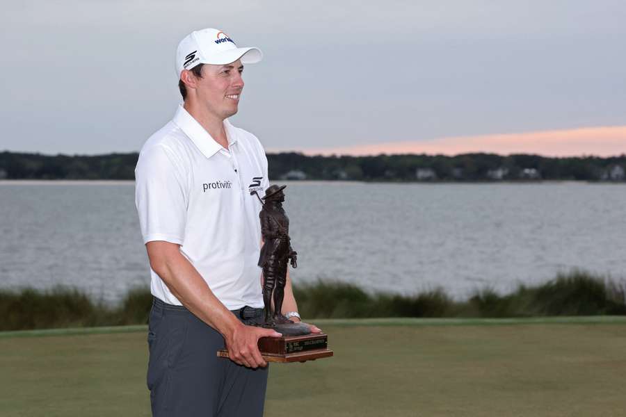 Matt Fitzpatrick poses with the trophy after winning the RBC Heritage.