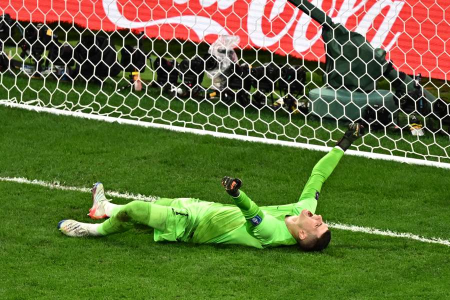 Dominik Livakovic celebrates his winning penalty save to send Croatia through to the semi-finals.