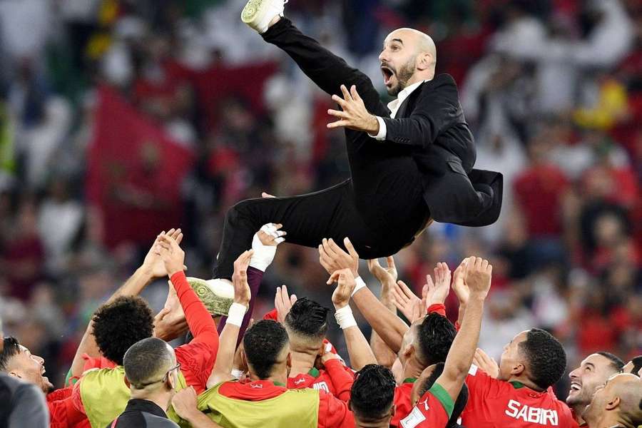 Morocco's manager being thrown in the air