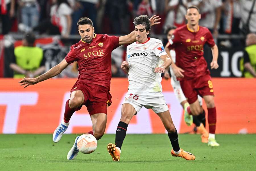 Roma's Zeki Celik and Sevilla's Marcao vie for the ball