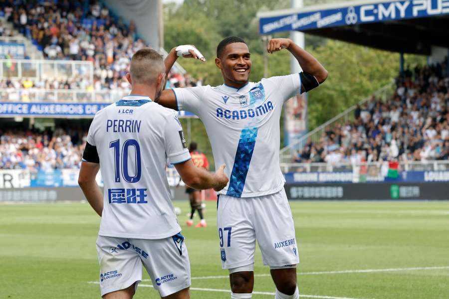 Rayan Raveloson (right) celebrates his goal for Auxerre