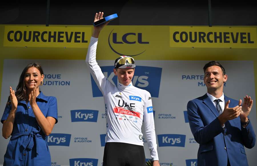 UAE Team Emirates' Slovenian rider Tadej Pogacar celebrates on the podium