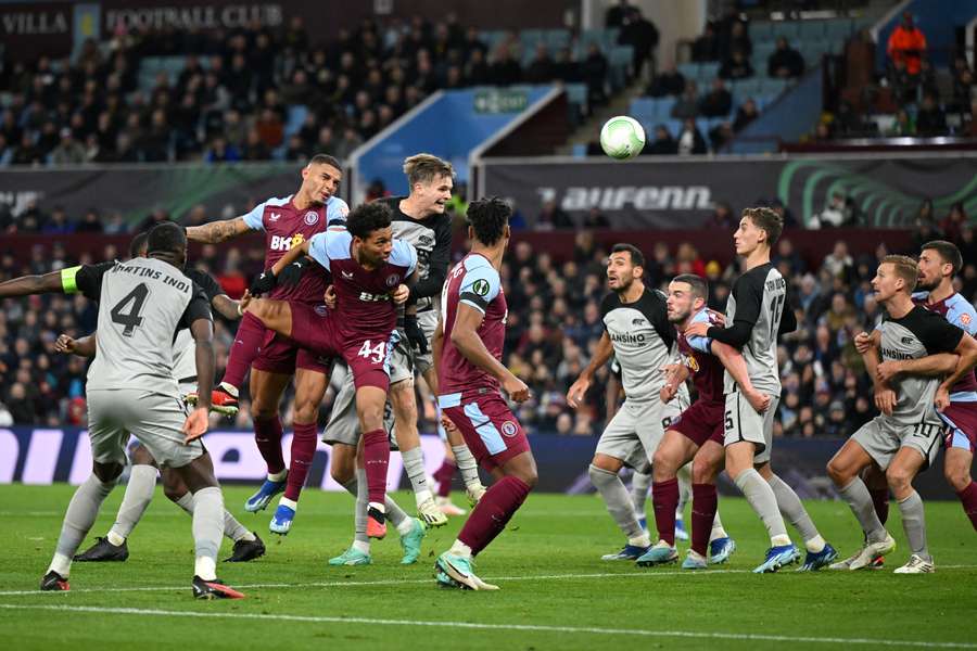 Diego Carlos of Aston Villa heads the ball and scores the team's first goal