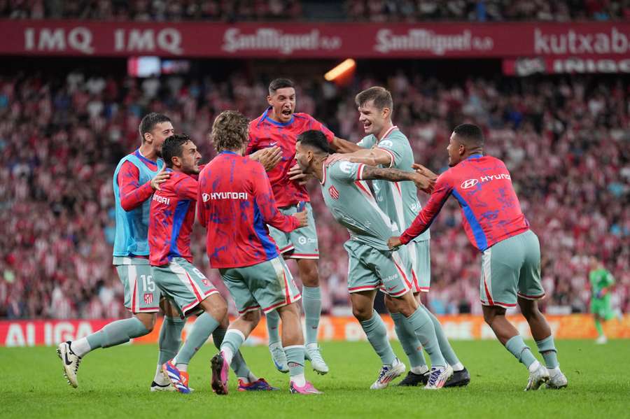 Angel Correa of Atletico Madrid celebrates with his teammates